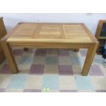 A contemporary oak dining table