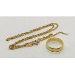 An 18ct gold wedding band along with an 18ct scrap gold chain - total weight 6.9g