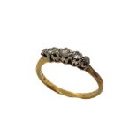 An 18ct gold ring with five diamonds