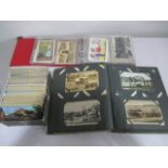 A collection of various postcards in two albums and loose