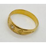 An unmarked gold (probably 18ct) gentleman's ring set with a single diamond. Weight 3.6g