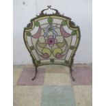 A stained glass fire screen