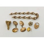 A collection of 9ct gold items including charm bracelet, cufflinks (A/F) etc. Total weight 31.5g