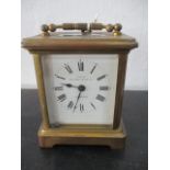 A brass carriage clock retailed by Munsey & Co Ltd, Cambridge