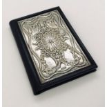 An address book (unused) with hallmarked silver front.