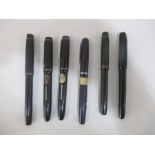 A collection of fountain pens, all with 14ct nibs including Cadet etc - one A/F