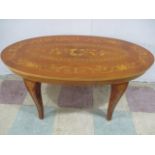 An Italian "inlaid" oval coffee table