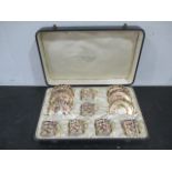 A cased set of Royal crown Derby Imari pattern coffee cans and saucers