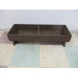 A vintage cast iron trough