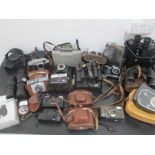 A collection of vintage camera, lens, binoculars, including Zenit, Minola, Dacora etc