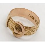 A 9ct rose gold buckle ring. Weight 3.2g