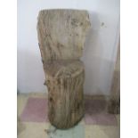 A rustic chair crudely made from the log of a tree, height 90cm