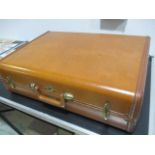 A Samsonite vintage suitcase with leather trim