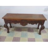 A hardwood buffet with carved decoration