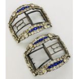 A pair of Georgian paste and enamelled buckles set in silver coloured metal and steel.
