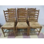 A set of six rush seated ladder back chairs