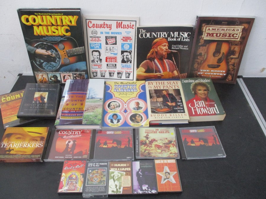 A collection of eight country music books, along with various music related DVD's, cassettes & CD's