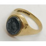 A 9ct gold gentleman's signet ring. Weight including stone 6.2g