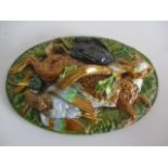 A 19th Century Majolica lid ( probably Mintons) from a game dish depicting a hare and poultry