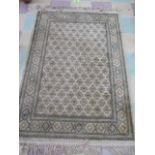 A beige ground Tabriz rug