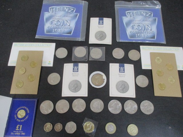 A collection of £5 coins (18) along with various other coinage