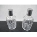 A pair of large perfume bottles with silver plated lids, etched mark to base Tudor, made in