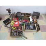 A collection of various tools and accessories including spanners, metal workers vice, pillar