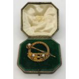 A West and Son Dublin Celtic design kilt brooch set with pearls in original case