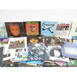 A collection of 12" vinyl records including Jethro Tull, U2, Boomtown Rats, Phil Collins, A-Ha, Paul