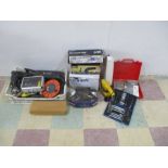 A collection of various power tools, tools and accessories including a hammer drill, sander,