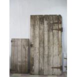 A large barn door ( 206 cm x 109 cm) along with a small door