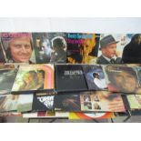 A collection of various vinyl records including Cliff Richard, Barry Manilow, Carpenters, Dr Hook,
