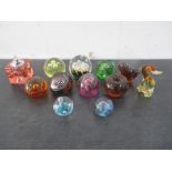 A collection of glass paperweights including Caithness etc