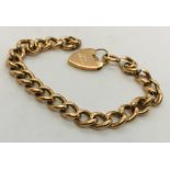 A 9ct rose gold bracelet with padlock. Weight 10.3g