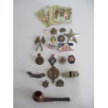 A collection of badges, silver medallion, pipe, Acme Thunderer etc.