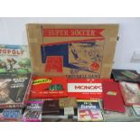 A collection of various vintage board games and jigsaw puzzles including super soccer, chess,