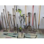 A collection of garden tools, Ryobi electric strimmer etc.