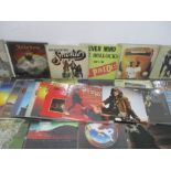 A collection of vinyl records including Rainbow, Fleetwood Mac, Jethro Tull, The Beatles, Barclay