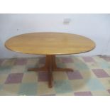 An oval Ercol dining table 164 cm x 122 cm
