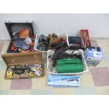A collection of various tools and accessories including a Renovator Twist-A-Saw, Auto Vacuum, Silver