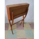 An F A Chandt 19th Century oak folding campaign desk with leather stationary compartment, on sabre X
