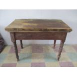 A small rustic pine table