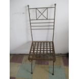 A vintage garden chair with strapwork seat
