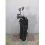 A set of vintage golf clubs including Howson irons, two Aldridge woods and a putter.