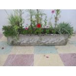 A concrete garden trough