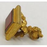 An ornate gilt fob set with an agate