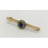 A 9ct gold sweetheart brooch with a sapphire and diamond cluster