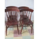 A set of four stained beech dining chairs