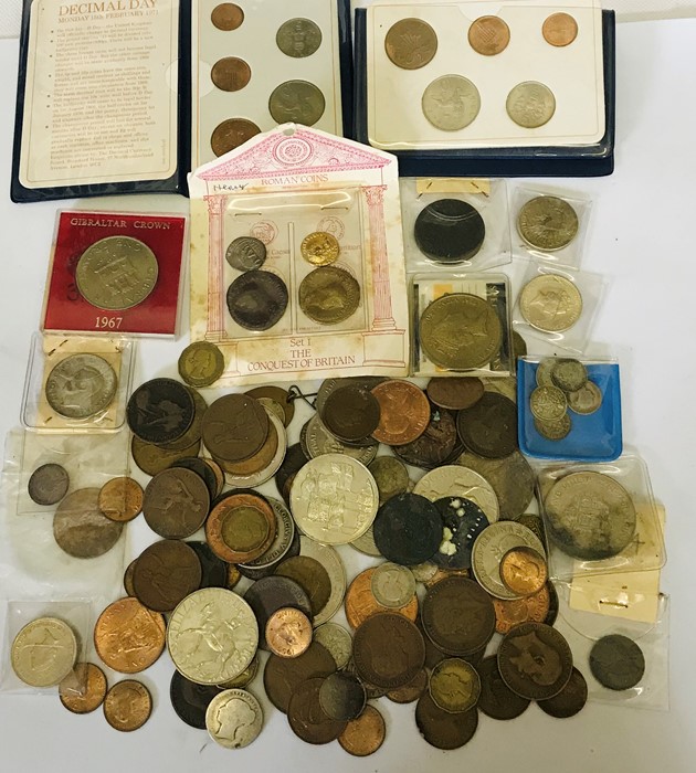 A collection of coinage including silver threepenny bits, £2 and £5 coins etc