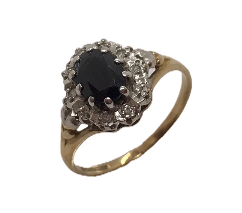 A 9ct gold ring with sapphire and diamonds